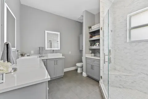 a bathroom with a bath tub and shower