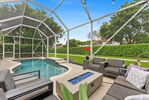 a view of a backyard with a swimming pool