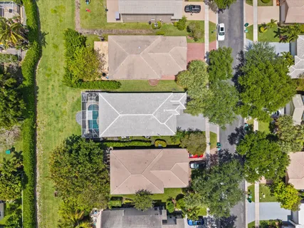 an aerial view of residential houses with outdoor space