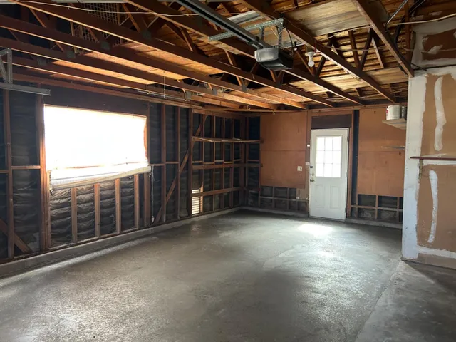 a view of a room with wooden walls