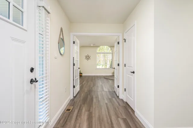 a view of a bathroom with wooden floor