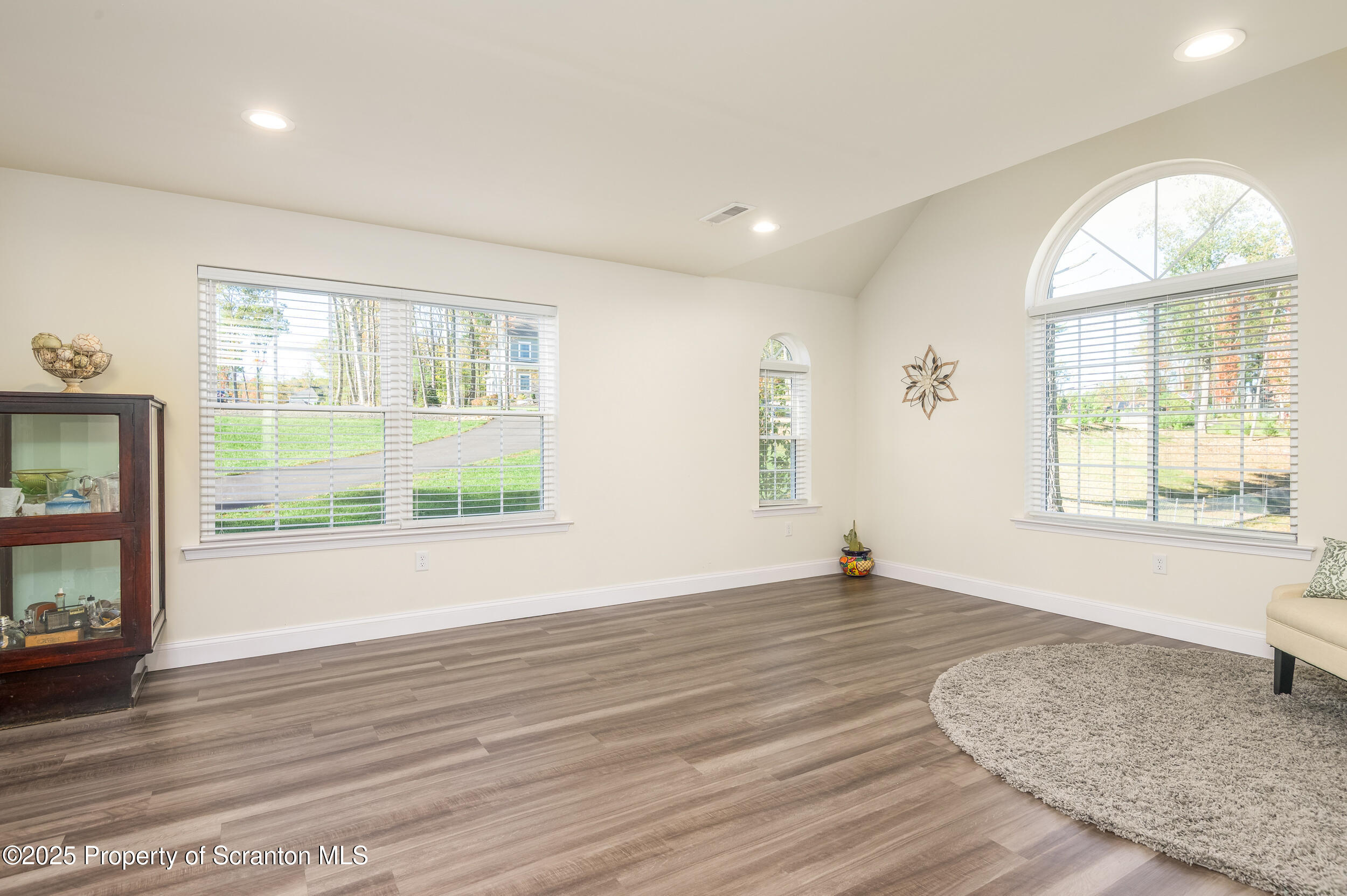 131 Chinaberry Way Kunkletown, PA 18058 - Photo 14 of 48 an empty room with wooden floor and windows