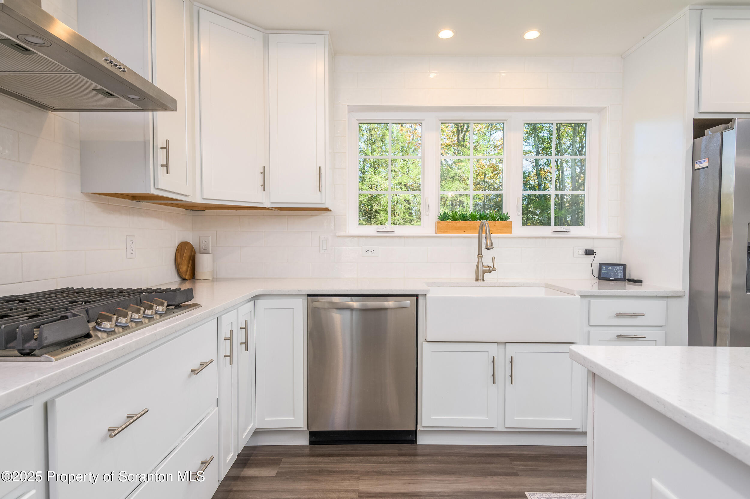 131 Chinaberry Way Kunkletown, PA 18058 - Photo 19 of 48 a kitchen with stainless steel appliances white cabinets and a stove top oven