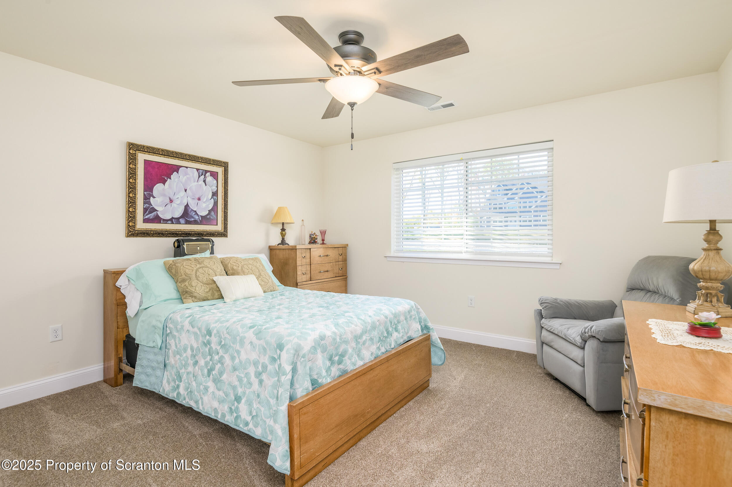 131 Chinaberry Way Kunkletown, PA 18058 - Photo 28 of 48 a bedroom with a bed couch and a window