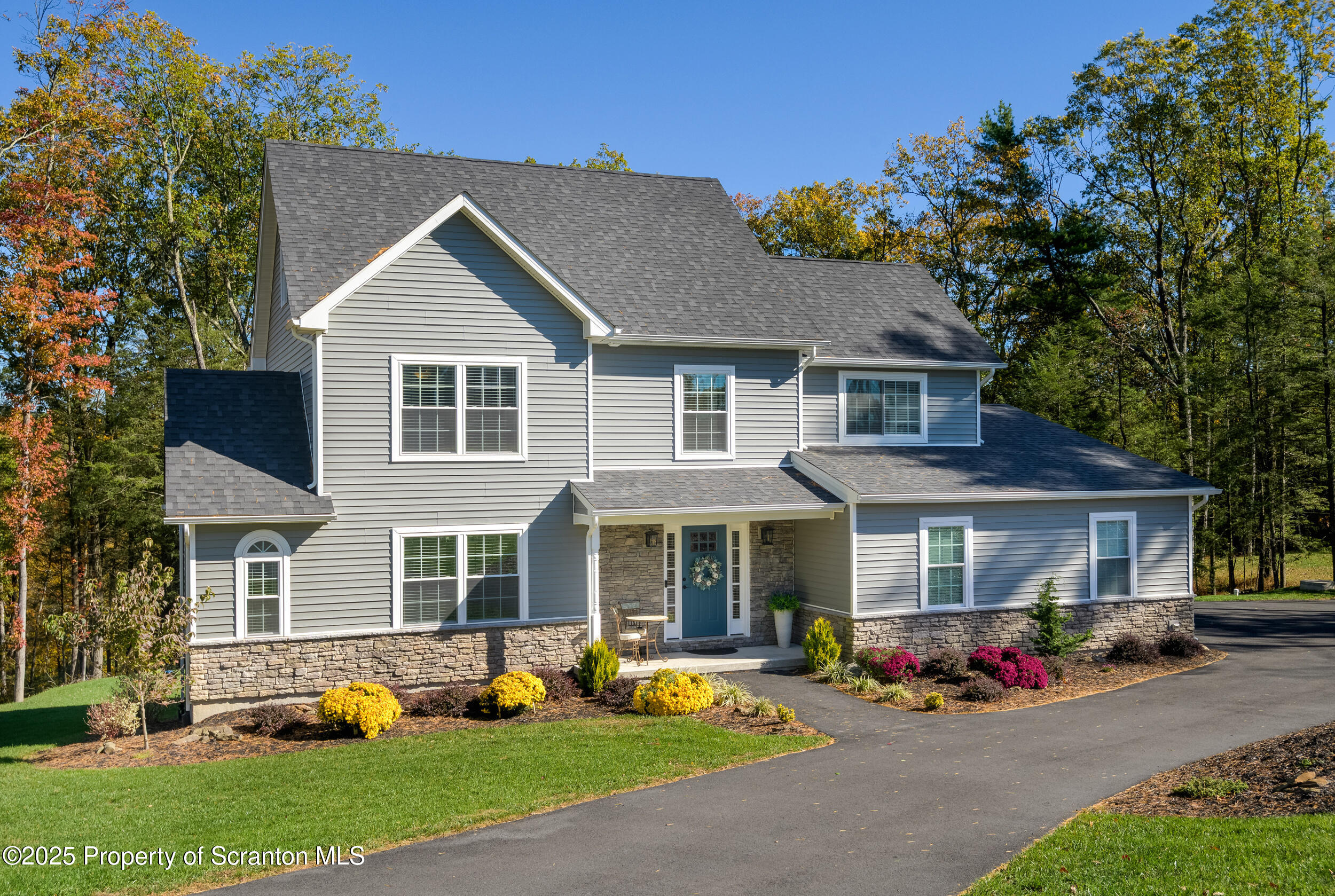 131 Chinaberry Way Kunkletown, PA 18058 - Photo 3 of 48 a front view of a house with garden and porch