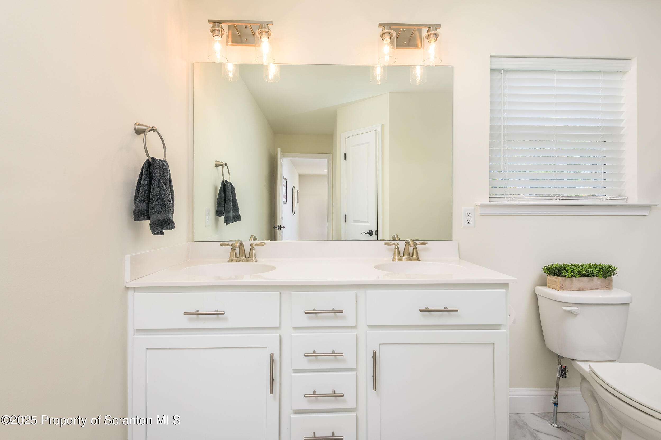 131 Chinaberry Way Kunkletown, PA 18058 - Photo 34 of 48 a bathroom with a sink a toilet and a mirror