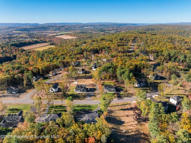 an aerial view of house with yard