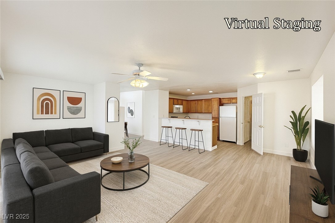 9416 Moon Splash Court Las Vegas, NV 89129 - Photo 14 of 47 Living area featuring light wood-style floors, ceiling fan, and recessed lighting