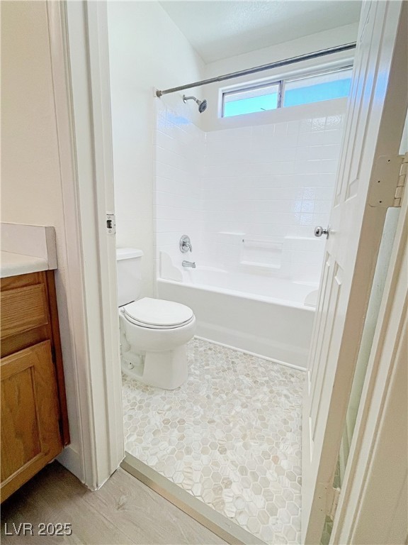 9416 Moon Splash Court Las Vegas, NV 89129 - Photo 34 of 47 Full bathroom with washtub / shower combination, vanity, and light wood-style floors