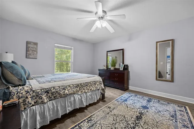 a bedroom with a bed and a dresser