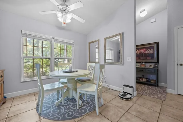 a dining room with furniture and window