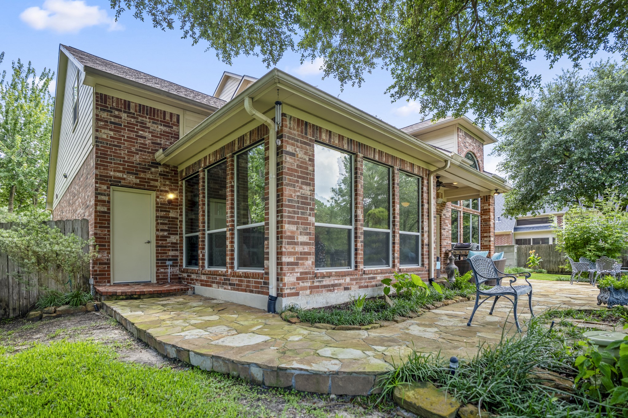 67 North Pentenwell Circle Spring, TX 77382 - Photo 44 of 50 a backyard of a house with yard and outdoor seating