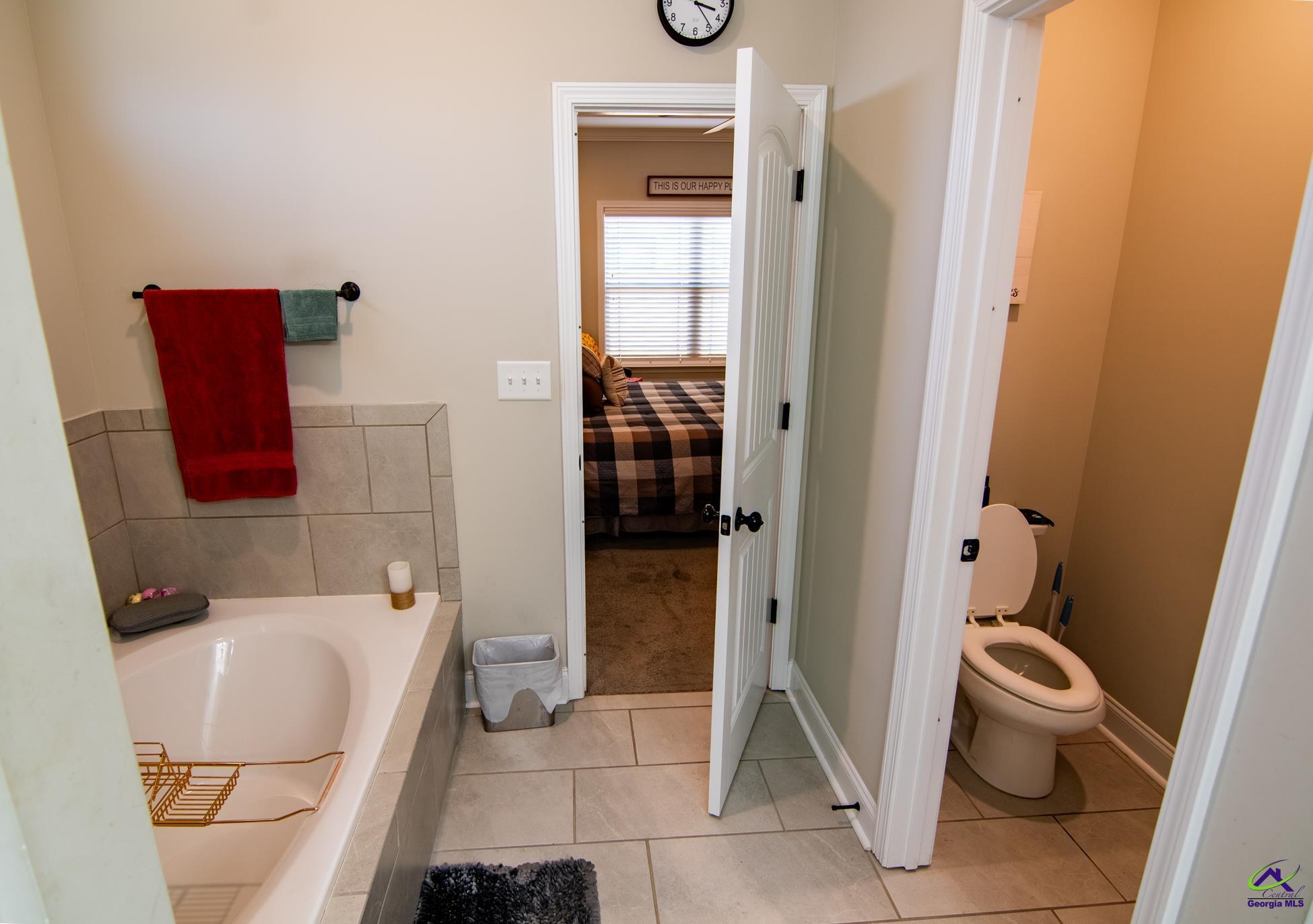 123 Logan's Mill Trail Warner Robins, GA 31093 - Photo 15 of 23 a bathroom with a toilet and a shower