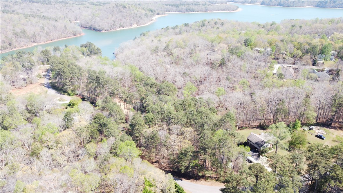 0 North Woodbury Road Seneca, SC 29672 - Photo 2 of 5 Perched on a sprawling lot, this property offers serene views of the surrounding natural landscape and a shimmering lake.