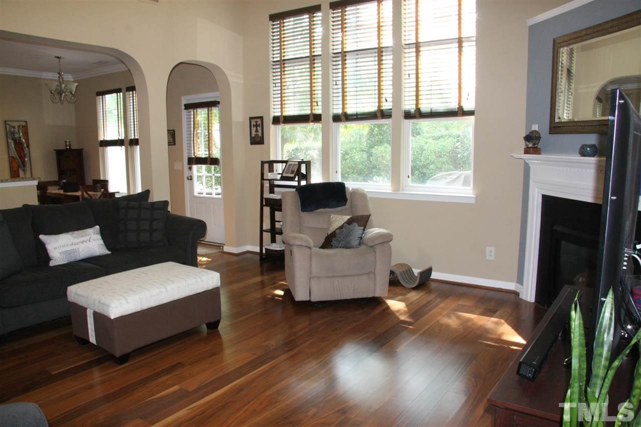 8305 Rubblestone Path Raleigh, NC 27613 - Photo 12 of 24 a living room with furniture and a fireplace