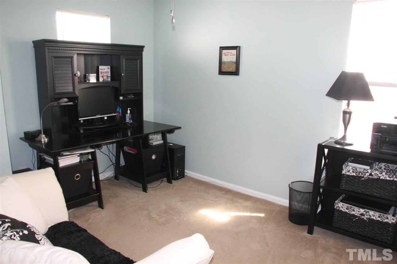 8305 Rubblestone Path Raleigh, NC 27613 - Photo 22 of 24 a living room with furniture and a flat screen tv