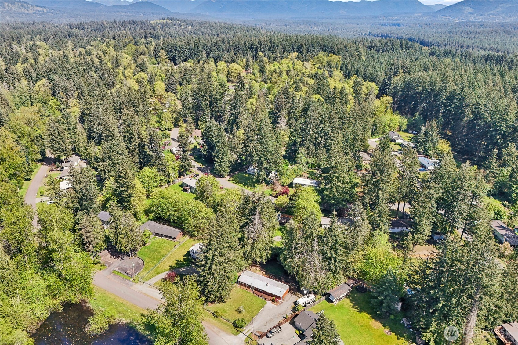 28601 Southeast 225th Street Maple Valley, WA 98038 - Photo 36 of 40 an aerial view of residential house with outdoor space and trees all around