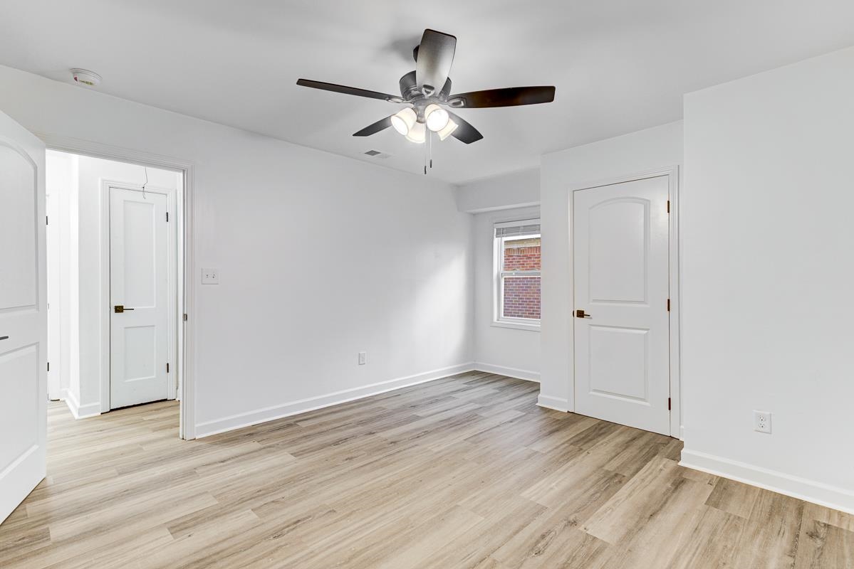 3512 Wilshire Road Memphis, TN 38111 - Photo 11 of 19 wooden floor in an empty room with a window