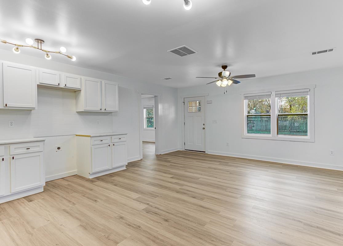 3512 Wilshire Road Memphis, TN 38111 - Photo 4 of 19 a view of an empty room with window and wooden floor