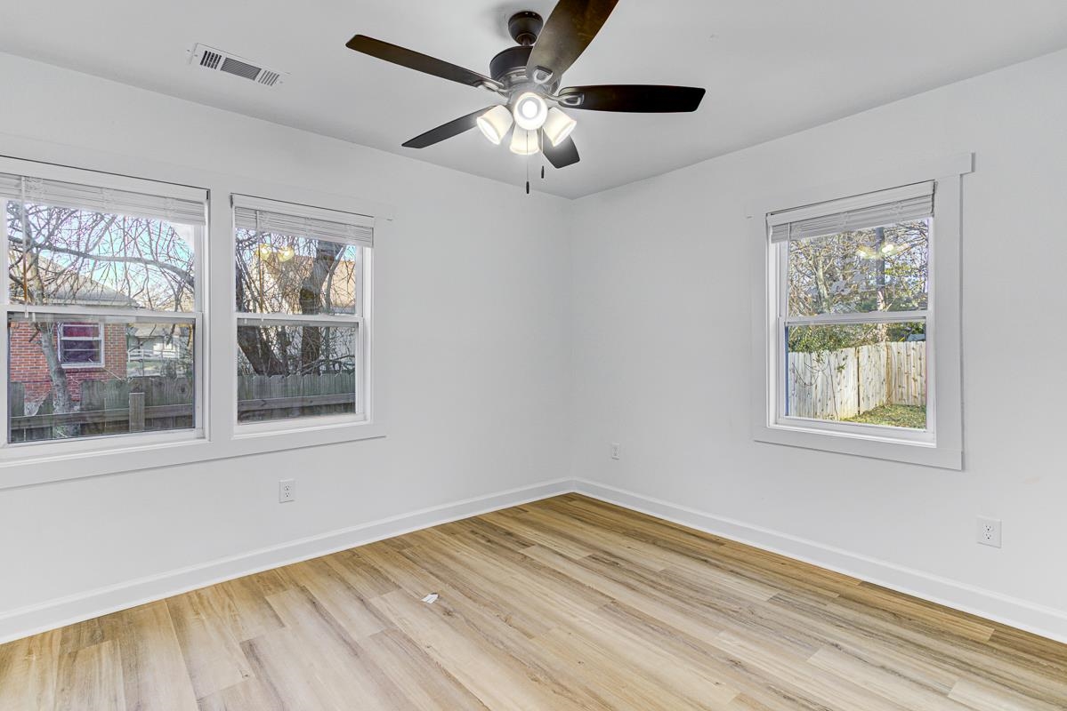 3512 Wilshire Road Memphis, TN 38111 - Photo 8 of 19 a view of empty room with wooden floor and fan