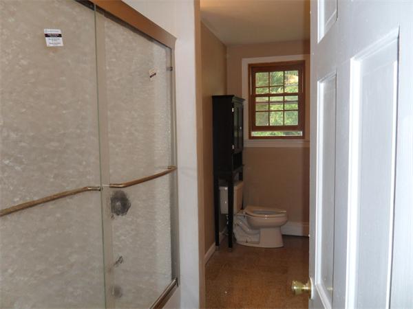 706 Main Street Boxford, MA 01921 - Photo 11 of 26 a bathroom with a toilet and a shower