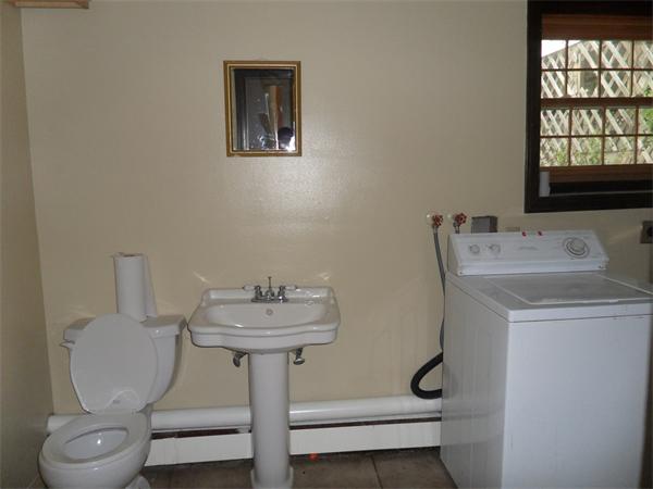 706 Main Street Boxford, MA 01921 - Photo 13 of 26 a bathroom with a sink toilet and a window
