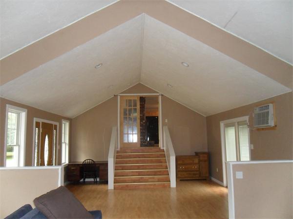706 Main Street Boxford, MA 01921 - Photo 17 of 26 a view of a livingroom with furniture and windows