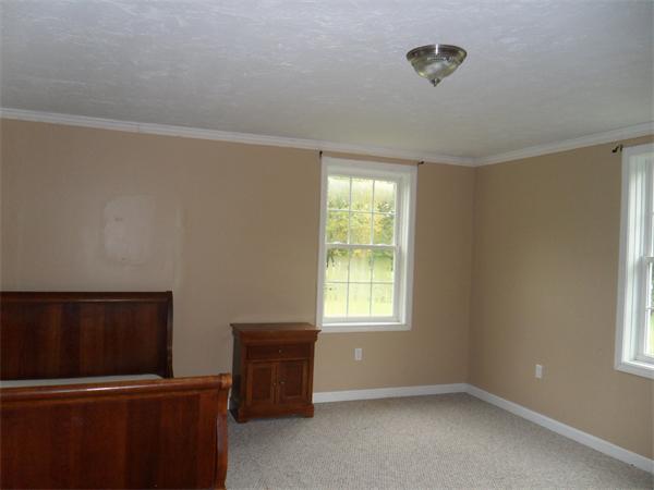 706 Main Street Boxford, MA 01921 - Photo 20 of 26 an empty room with windows