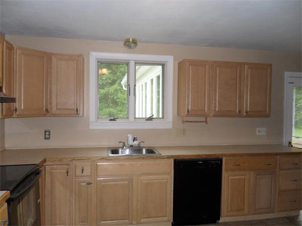 706 Main Street Boxford, MA 01921 - Photo 3 of 26 a kitchen with granite countertop cabinets sink and window