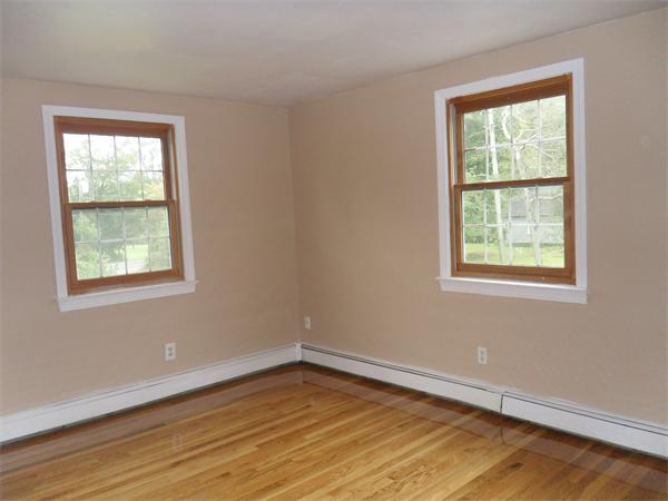 706 Main Street Boxford, MA 01921 - Photo 8 of 26 an empty room with a window