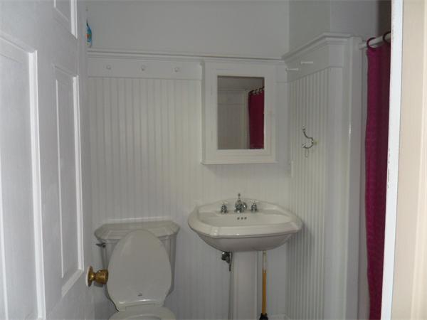 706 Main Street Boxford, MA 01921 - Photo 10 of 26 a bathroom with a sink toilet and mirror