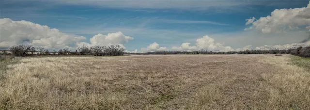 a view of a house with a yard and a garden
