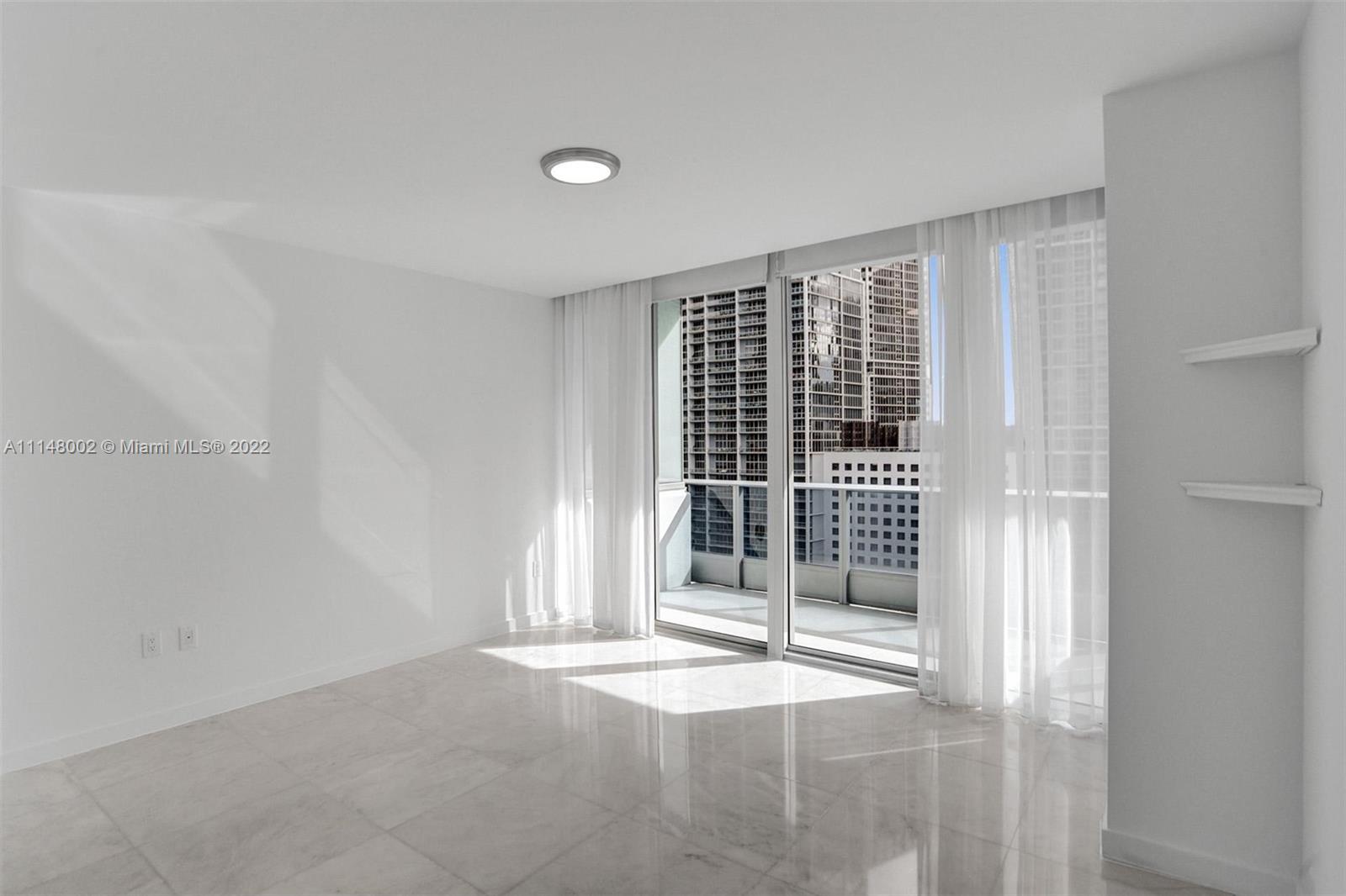 200 Biscayne Blvd Way, Unit 1403 Miami, FL 33131 - Photo 24 of 67 a view of empty room with floor to ceiling window