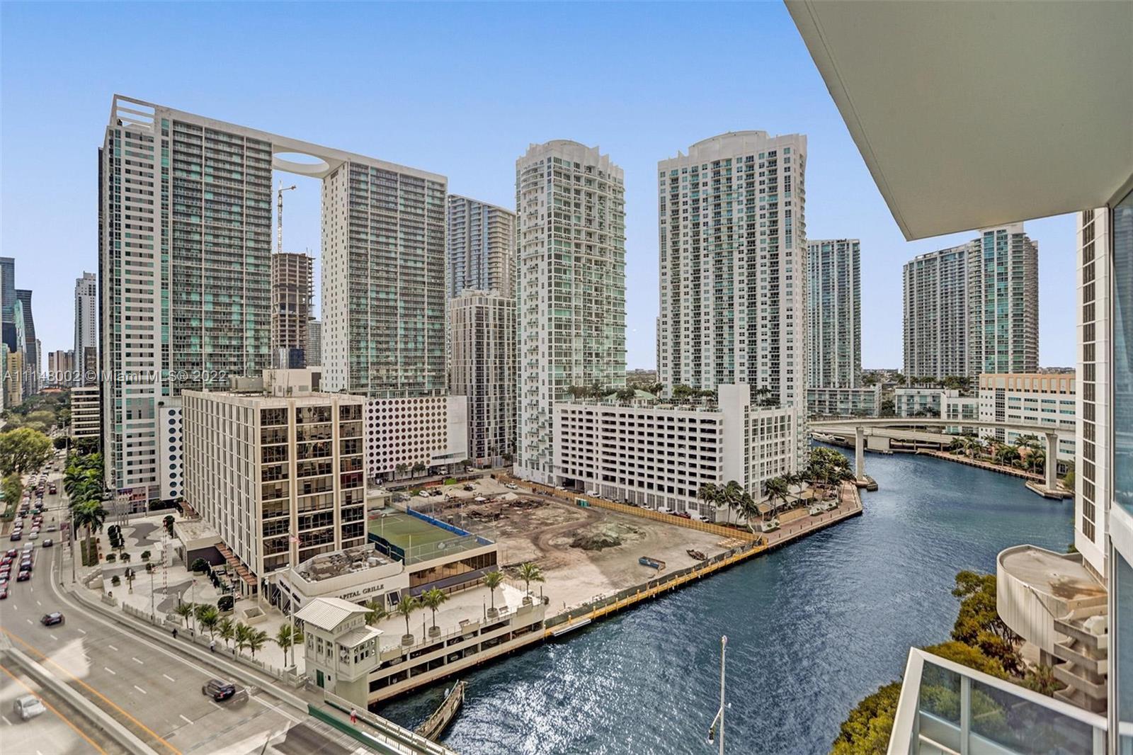 200 Biscayne Blvd Way, Unit 1403 Miami, FL 33131 - Photo 46 of 67 a view of a balcony with floor to ceiling window and wooden floor