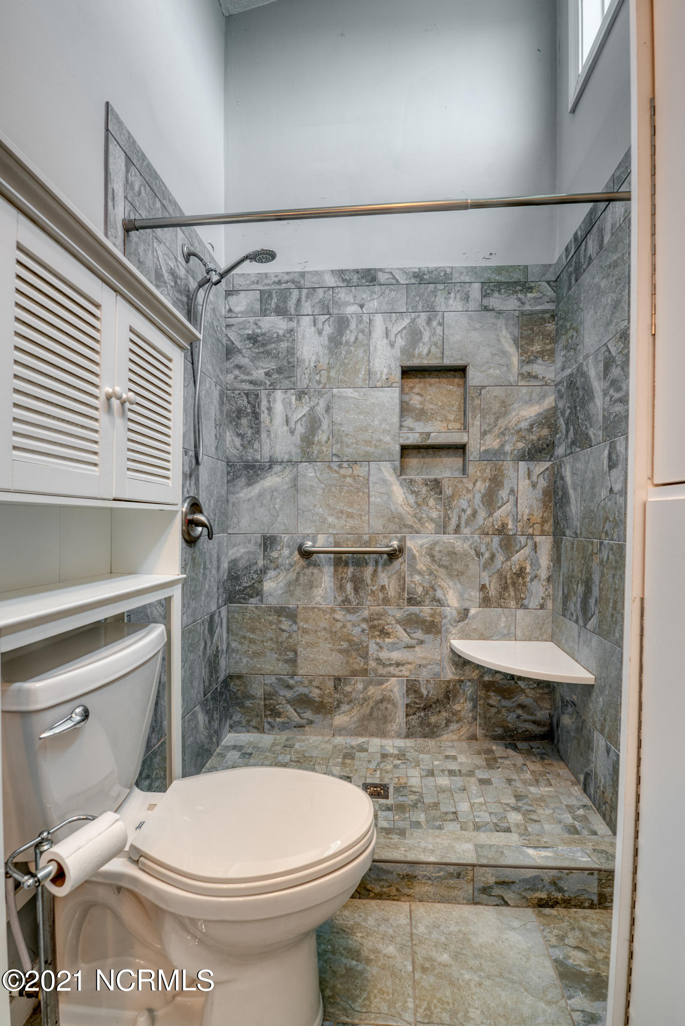 1779 New River Inlet Road, Unit 1 North Topsail Beach, NC 28460 - Photo 24 of 35 Oversized custom master shower walk in custom tiled!