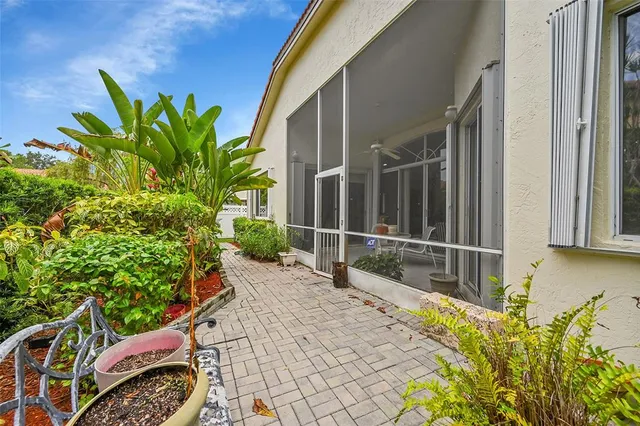 a view of a swimming pool and a yard