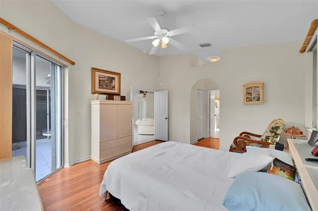 a bathroom with a double vanity sink mirror and bathtub