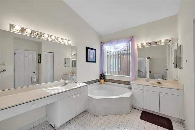 a kitchen with granite countertop cabinets and stainless steel appliances