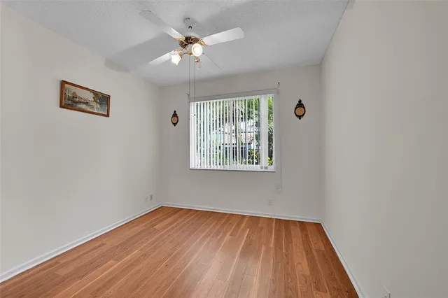 a bathroom with a sink vanity granite toilet tub and shower