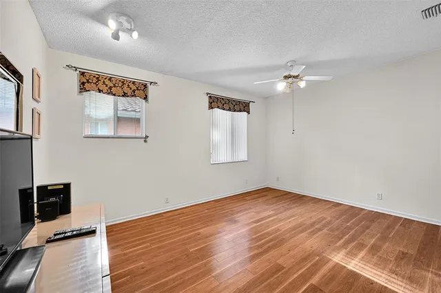a bathroom with a sink toilet a mirror and shower