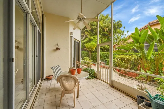 a view of a pathway with plants