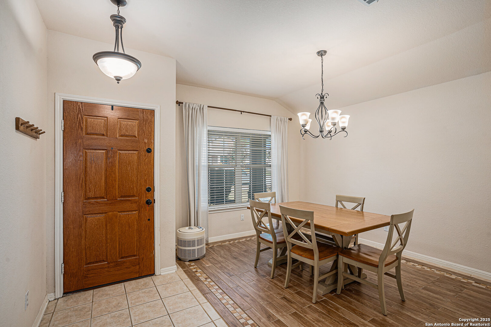 117 Hidden Fawn Cibolo, TX 78108 - Photo 12 of 25 a view of a dining room with furniture window and wooden floor