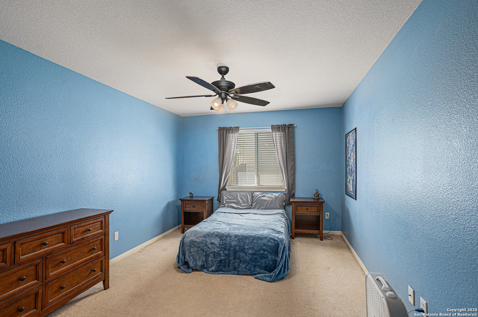 117 Hidden Fawn Cibolo, TX 78108 - Photo 19 of 25 a bedroom with a bed and window