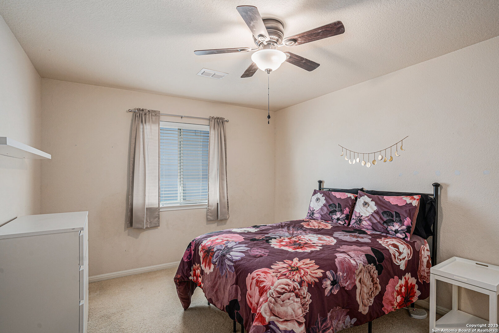117 Hidden Fawn Cibolo, TX 78108 - Photo 21 of 25 a bedroom with a bed and a window