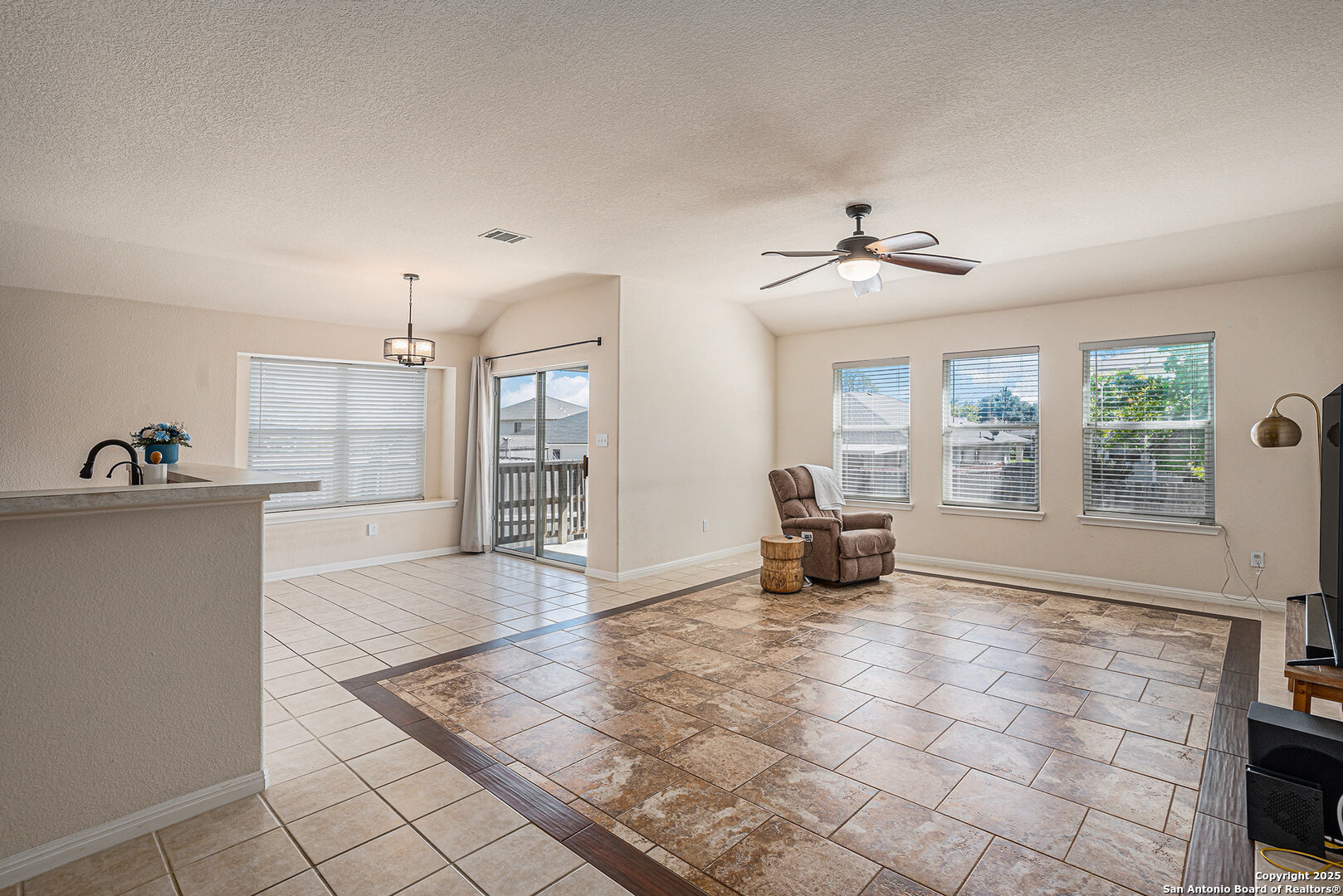 117 Hidden Fawn Cibolo, TX 78108 - Photo 3 of 25 a living room with furniture and a fireplace