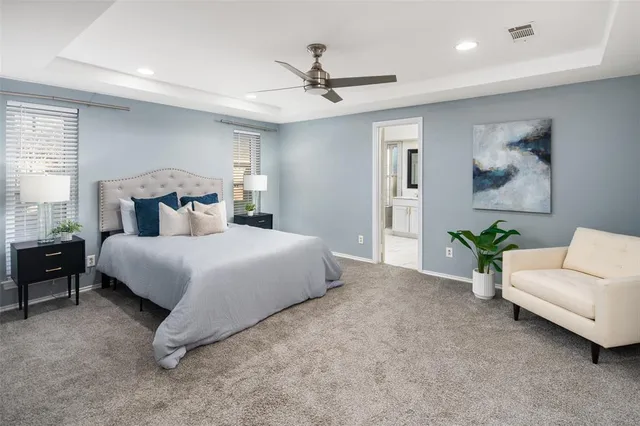 a bedroom with a bed and a couch