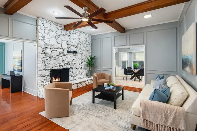 a living room with furniture and a fireplace