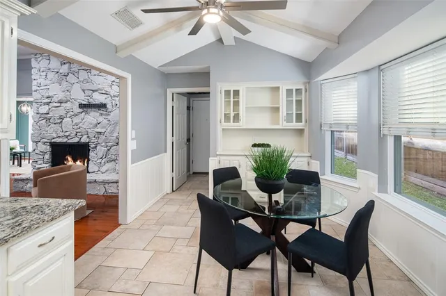 a dining room with furniture and window