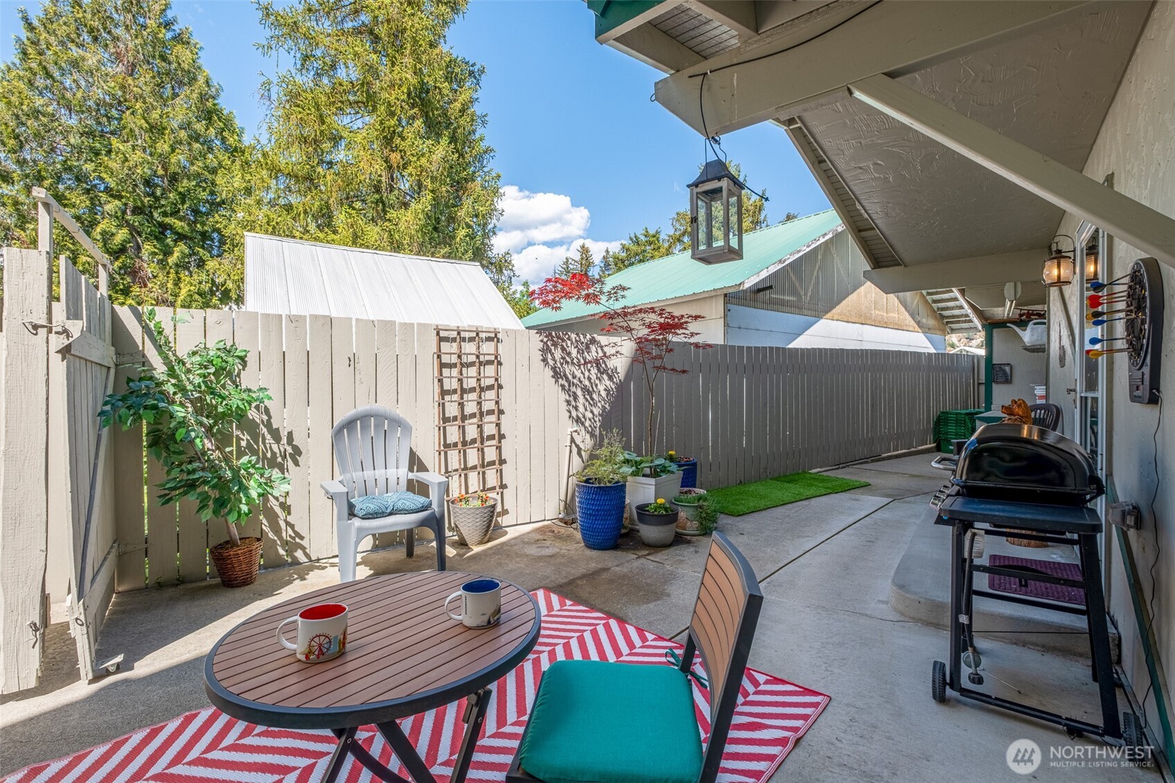 8348 Main Street, Unit 1 Peshastin, WA 98847 - Photo 17 of 40 a backyard of a house with fire pit and outdoor seating