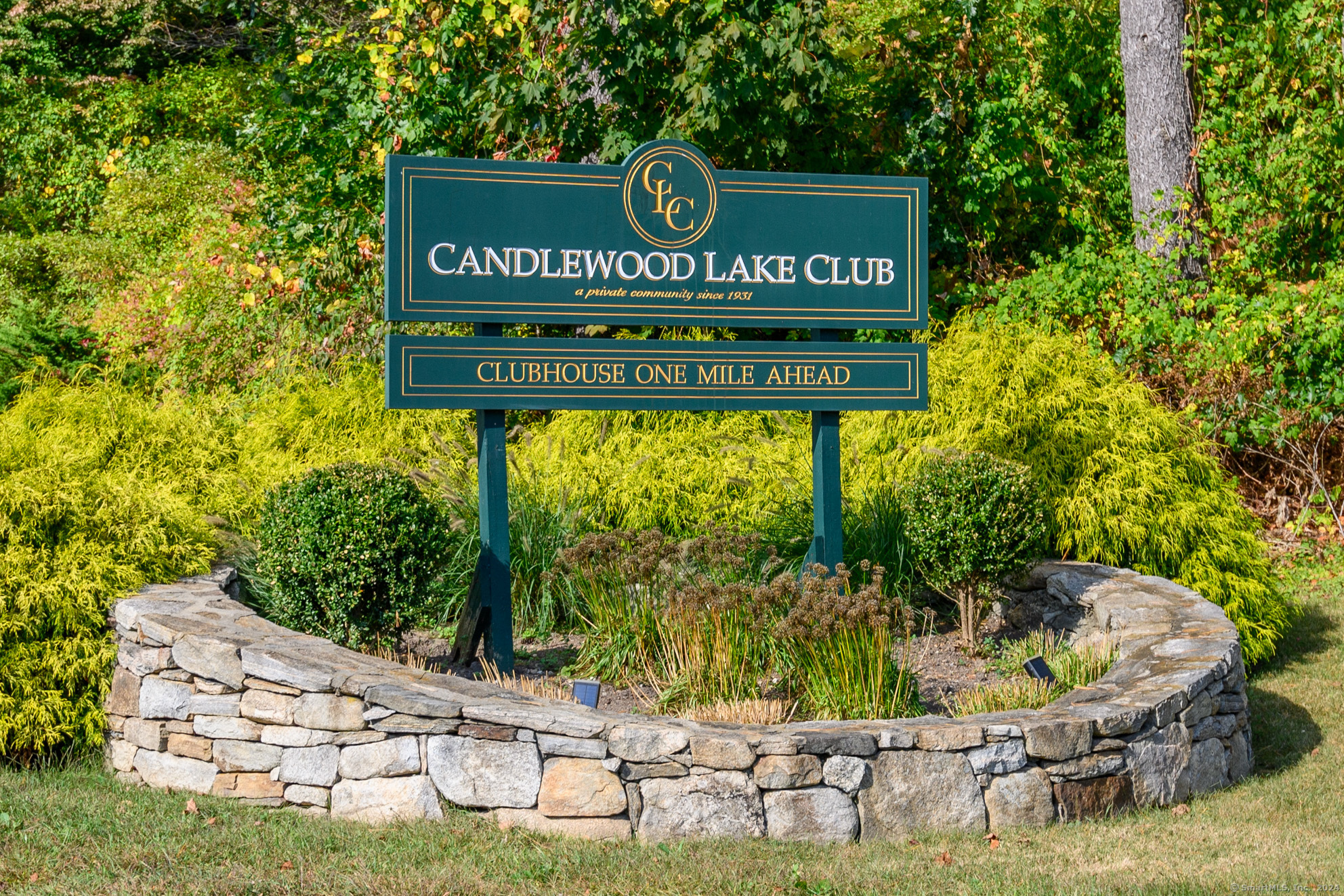 22 Brookside Trail New Milford, CT 06776 - Photo 1 of 40 a view of outdoor space with signage and flags